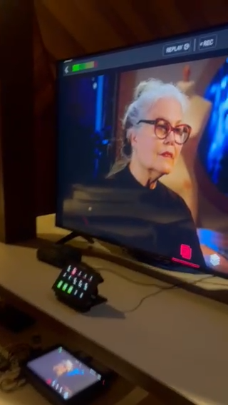 YoloBox live streaming setup with REPLAY and REC interface active during a live production